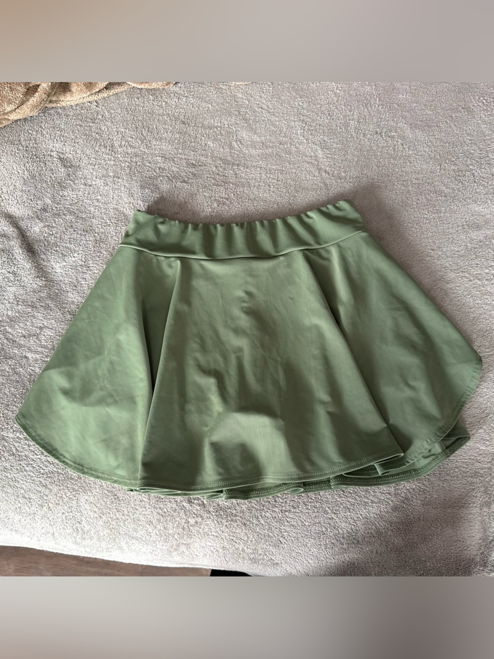 Green pleated mini skirt with built-in shorts